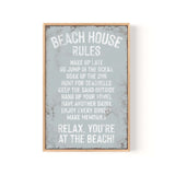 a framed sign that says beach house rules