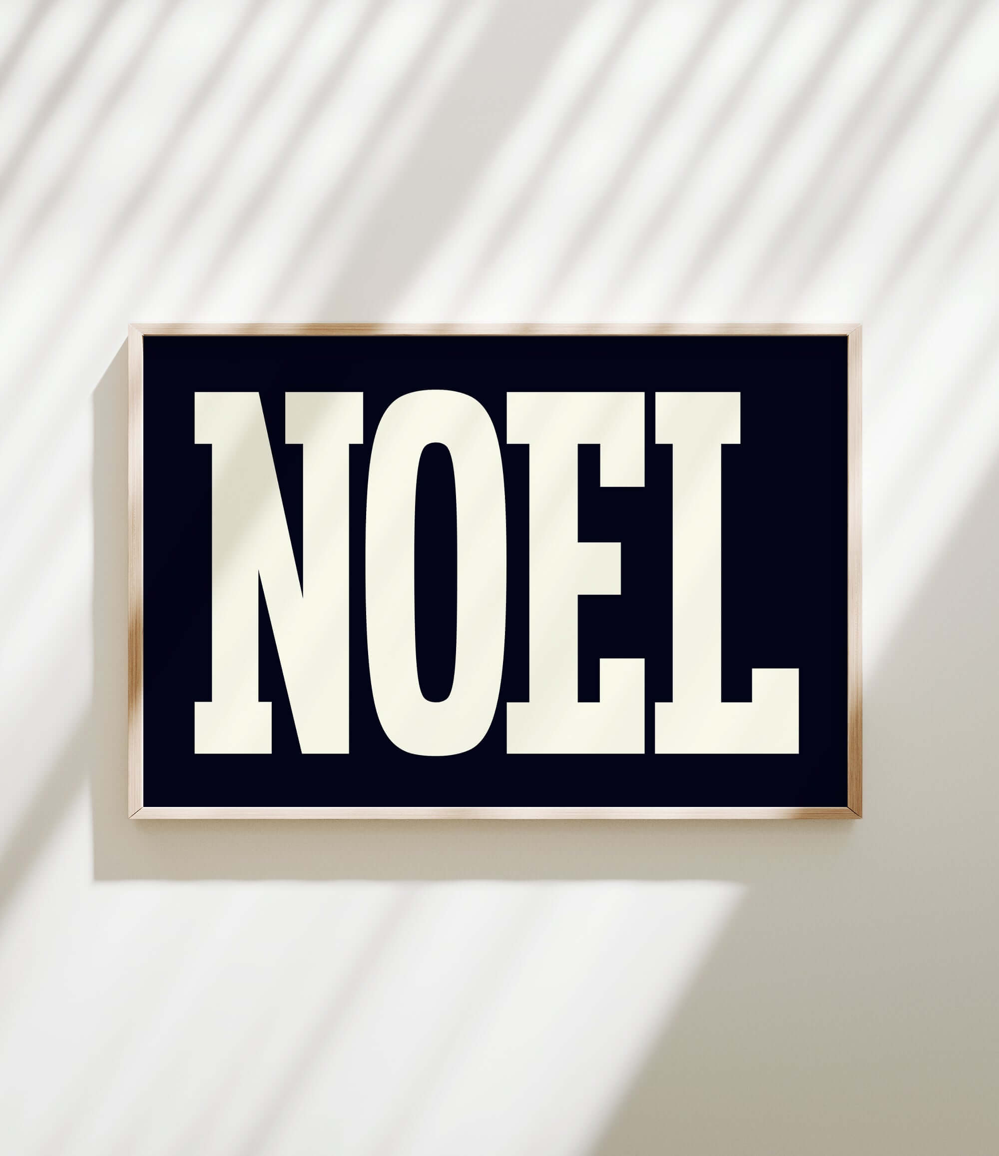 a black and white sign with the word noel on it