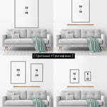 Four size options for the Beach House Rules Sign, Painted Wood, Coral, are displayed above a gray loveseat with a teal blanket and wood shelf—ideal for adding coastal charm to your modern beach house décor.