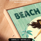 The image is a framed artwork featuring a beach scene with palm trees and a woman. The artwork is framed in a natural frame and has artwork wrapped around the sides.