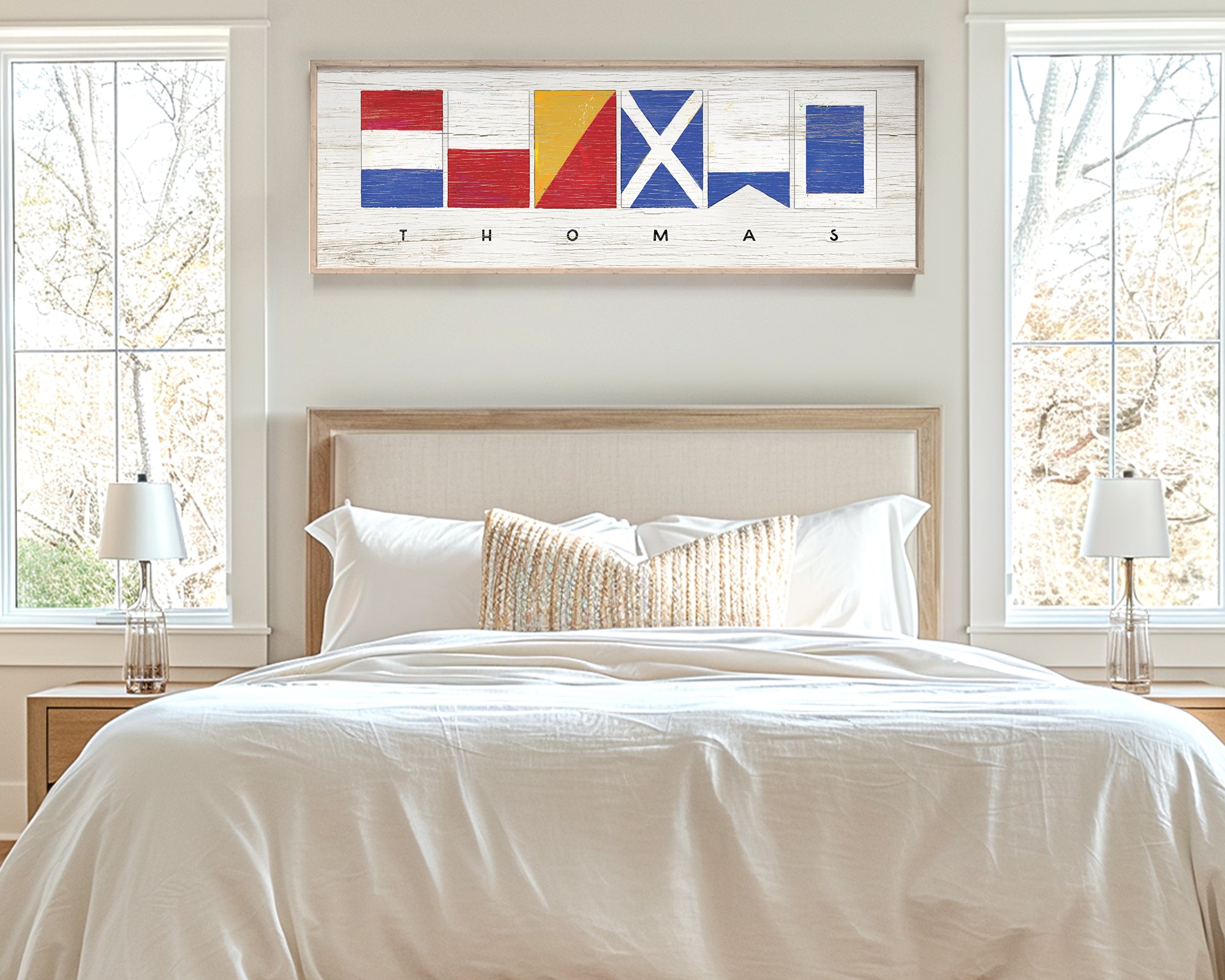 a bedroom with a bed and two windows