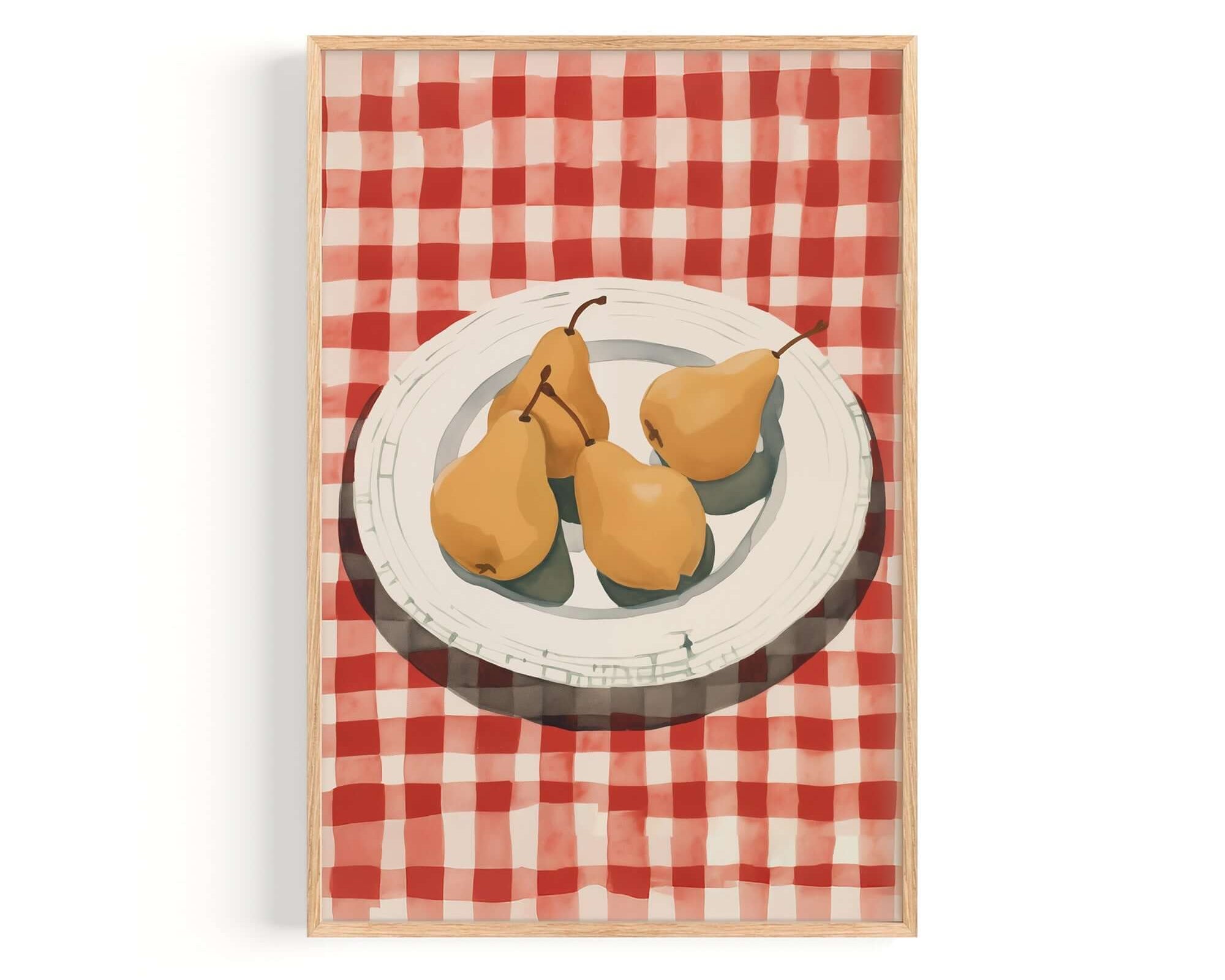 A framed illustration of three pears on a white plate, set against a red and white checkered tablecloth.