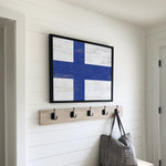 a wooden bench with a coat rack and a bag on it