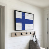 a wooden bench with a coat rack and a bag on it
