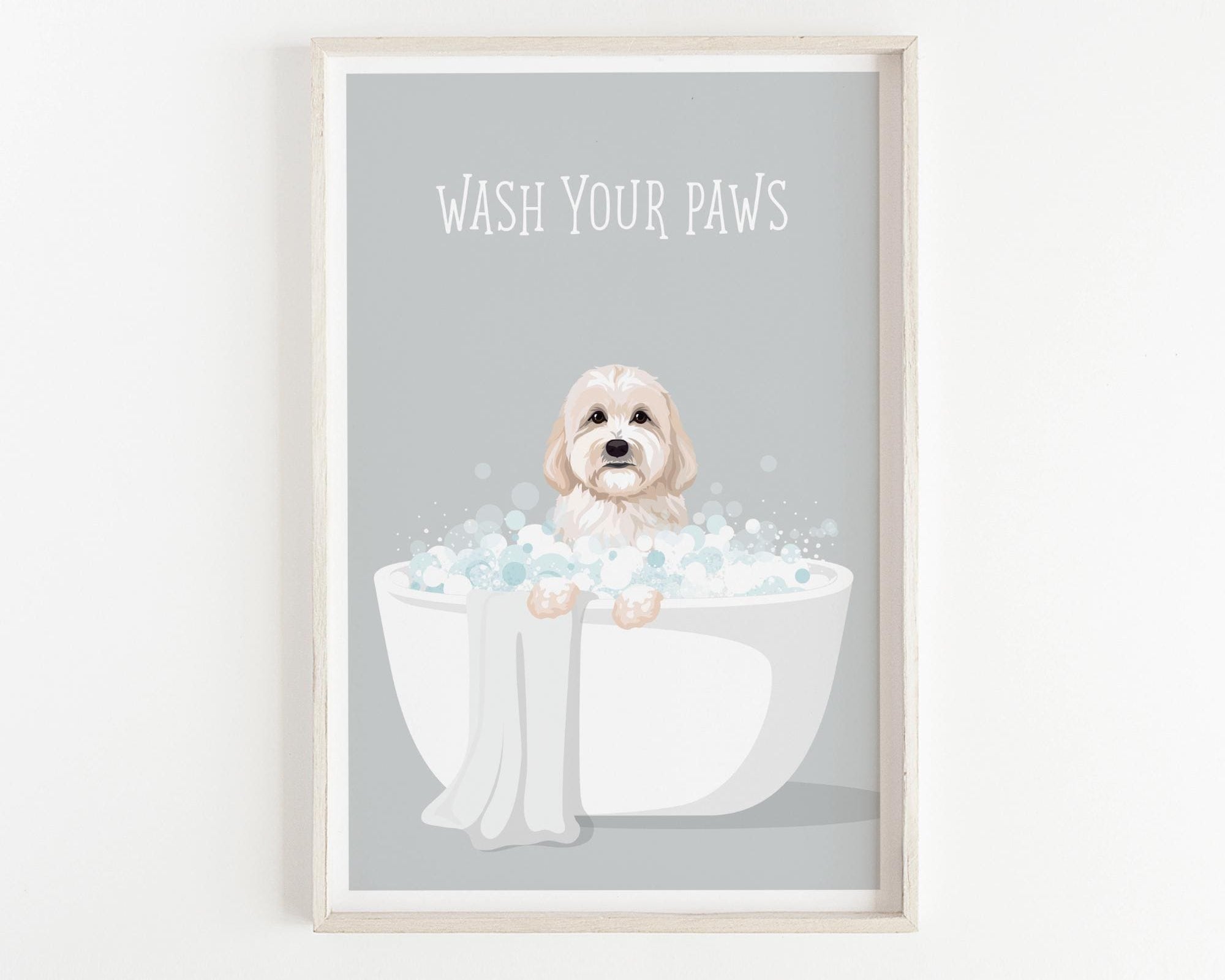 A framed illustration of a dog sitting in a bathtub filled with bubbles, with the text "WASH YOUR PAWS" displayed above it.