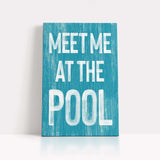 a blue sign that says meet me at the pool