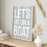 a sign that says let&#39;s go on a boat on a shelf