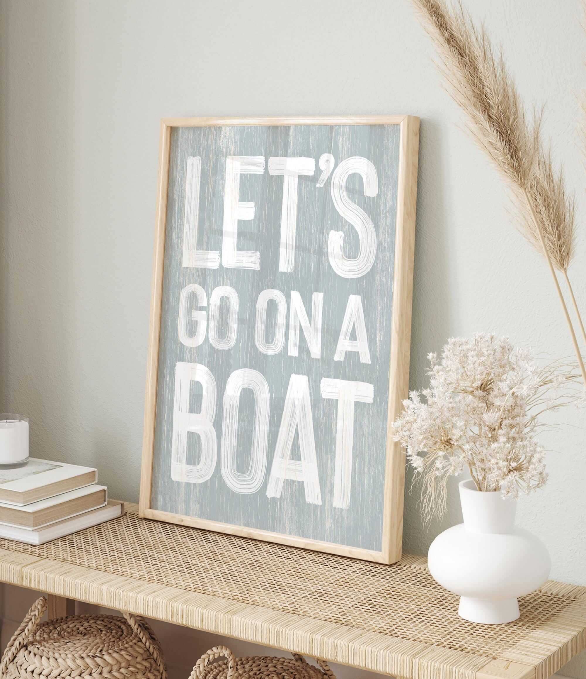 a sign that says let&#39;s go on a boat on a shelf