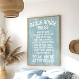 The Beach House Rules Sign, Painted Wood, Tide, hangs on the wall of a coastal-themed bedroom, adding charming beach house decor with its relaxed guidelines.