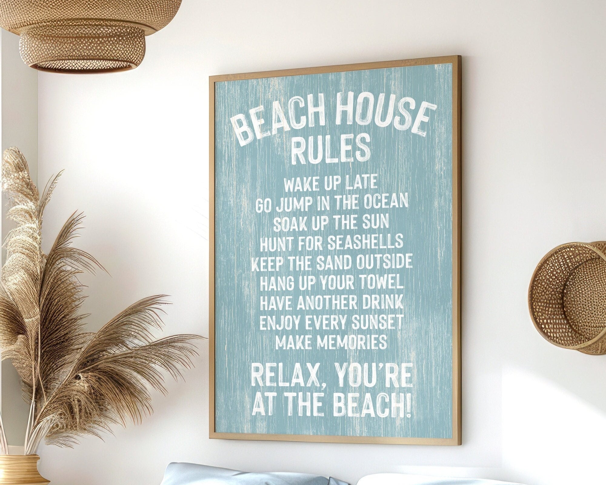 The Beach House Rules Sign, Painted Wood, Tide, hangs on the wall of a coastal-themed bedroom, adding charming beach house decor with its relaxed guidelines.