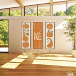 a living room with three pumpkins on the wall