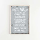 a sign that says pool rules hanging on a wall