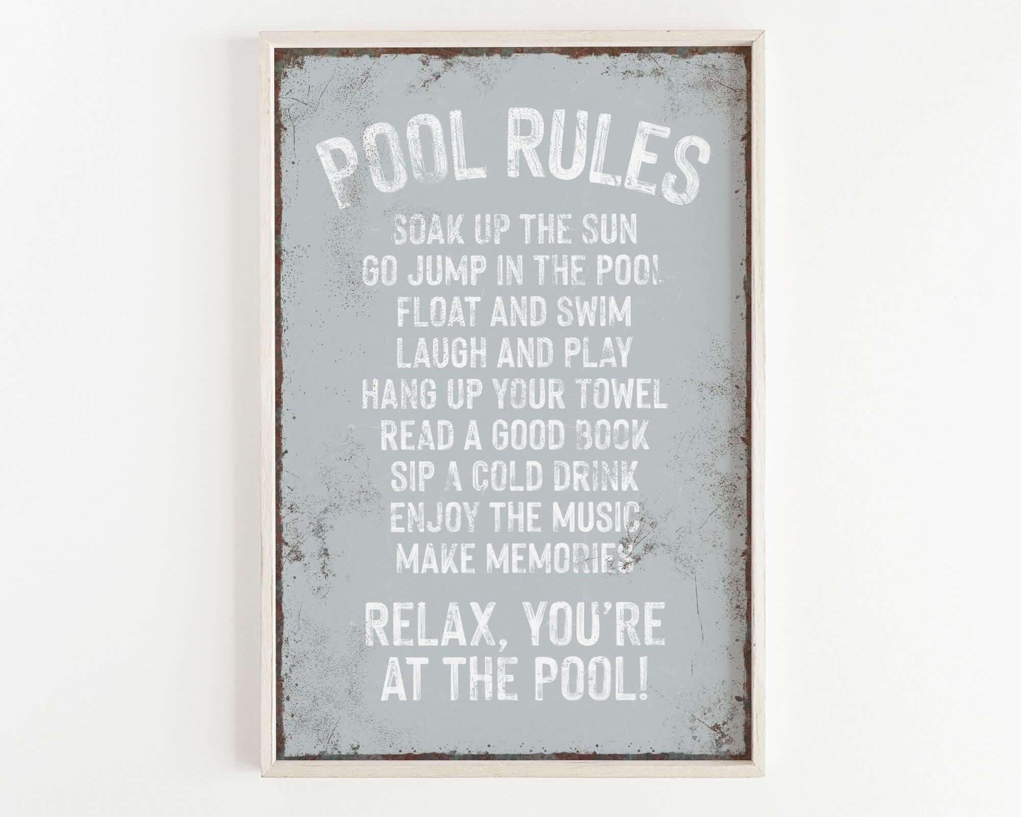 a sign that says pool rules hanging on a wall