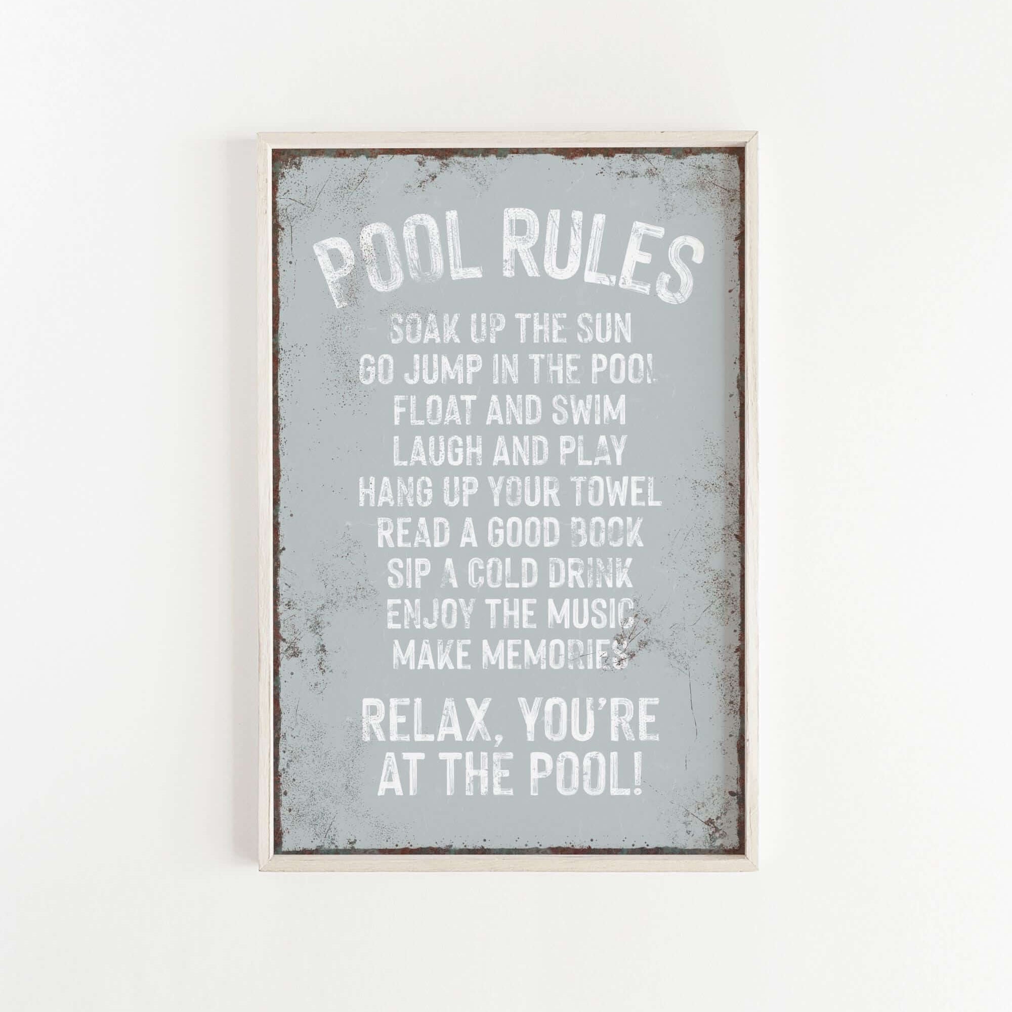 a sign that says pool rules hanging on a wall