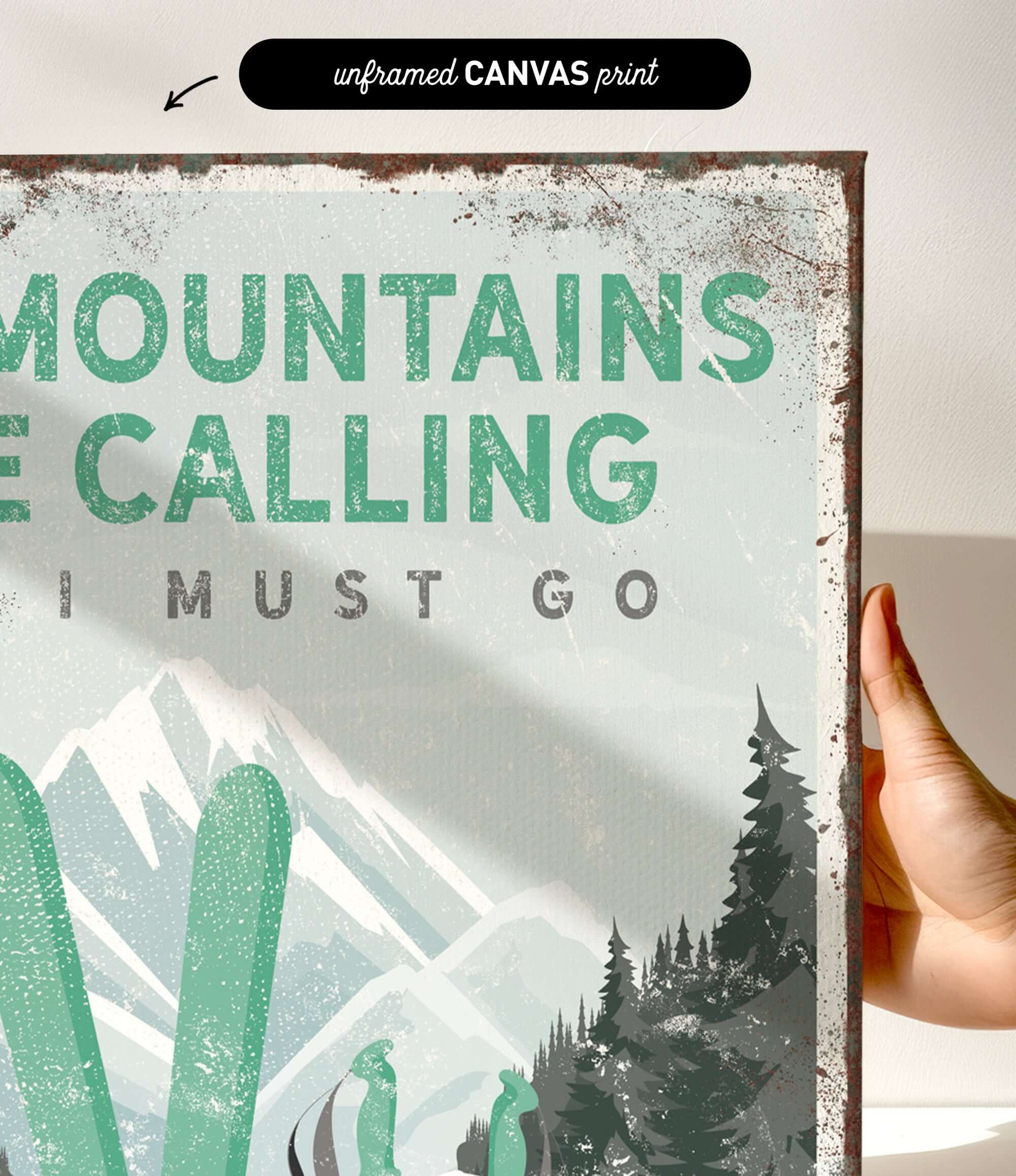 a hand holding a sign that says mountains are calling