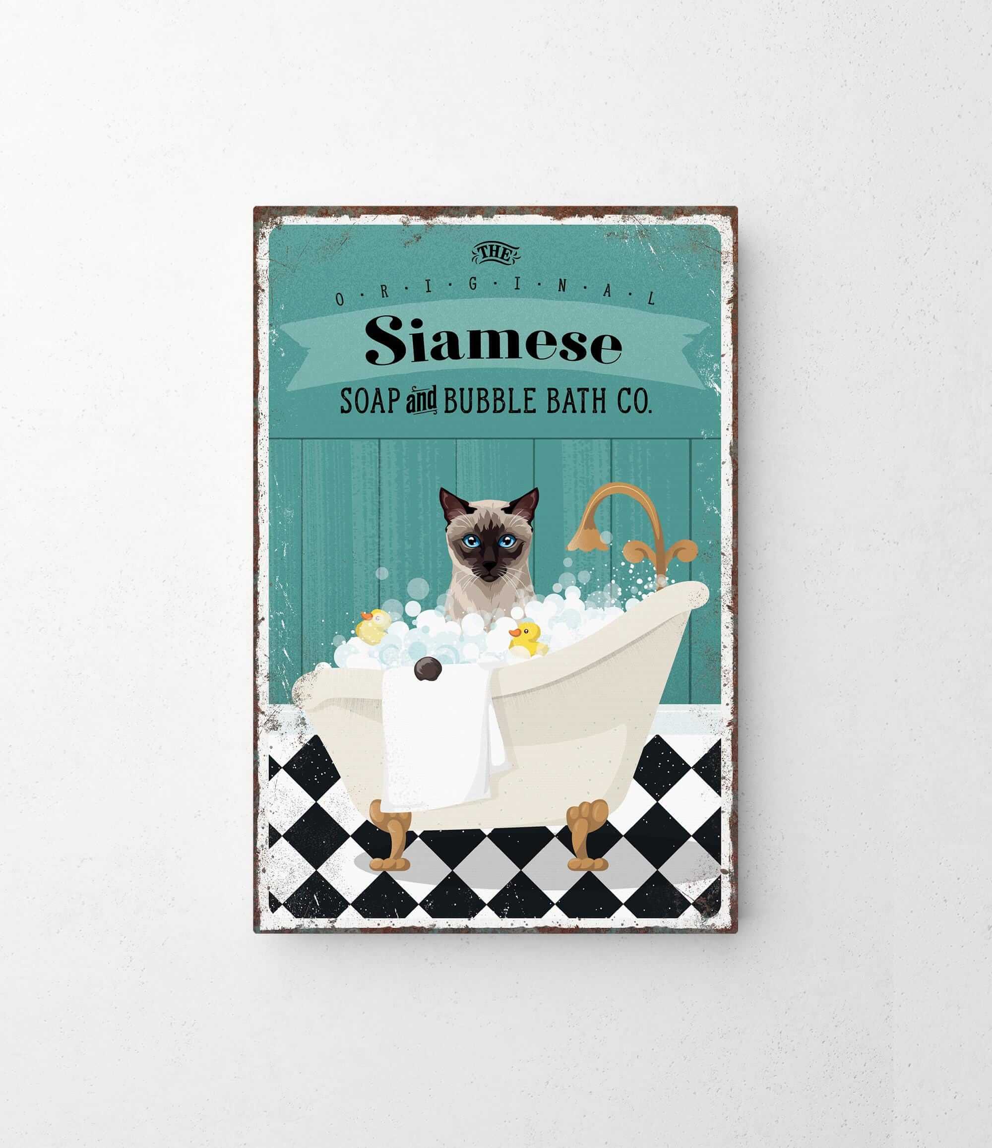 A vintage-style poster advertising Siamese Soap and Bubble Bath Co., featuring a Siamese cat sitting in a bathtub filled with bubbles.