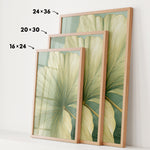 three framed prints of a large green leaf, each with a different size and frame. The prints are arranged in a row, with the largest one being 24 x 36 inches, the medium one being 20 x 30 inches, and the smallest one being 16 x 24 inches.