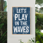 a blue sign that says let&#39;s play in the waves