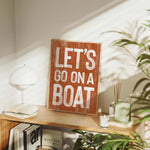 a wooden sign that says let&#39;s go on a boat