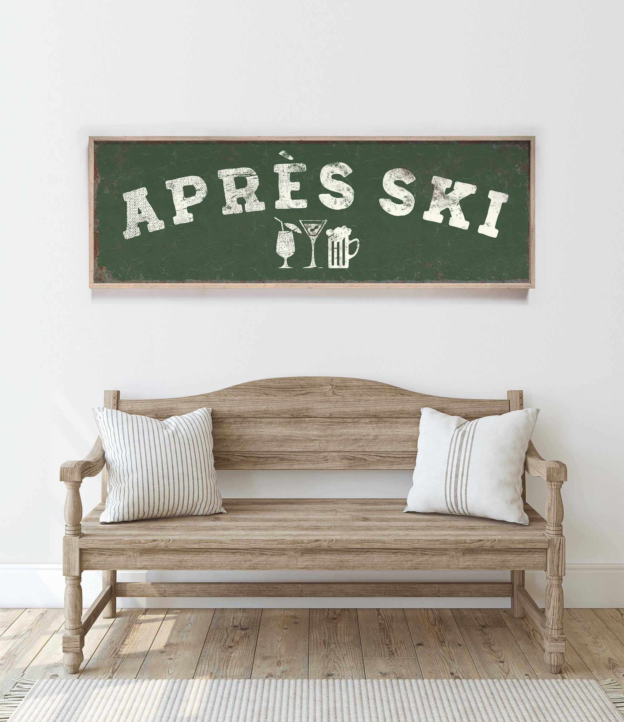 a wooden bench with two pillows, and above it is a green sign with white text that says "APRÈS SKI".