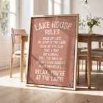a sign that reads "LAKESHOUSE RULES" in a rustic wooden frame, placed in a room with a dining table and chairs.