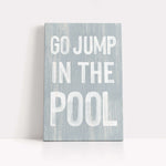 a sign that says go jump in the pool