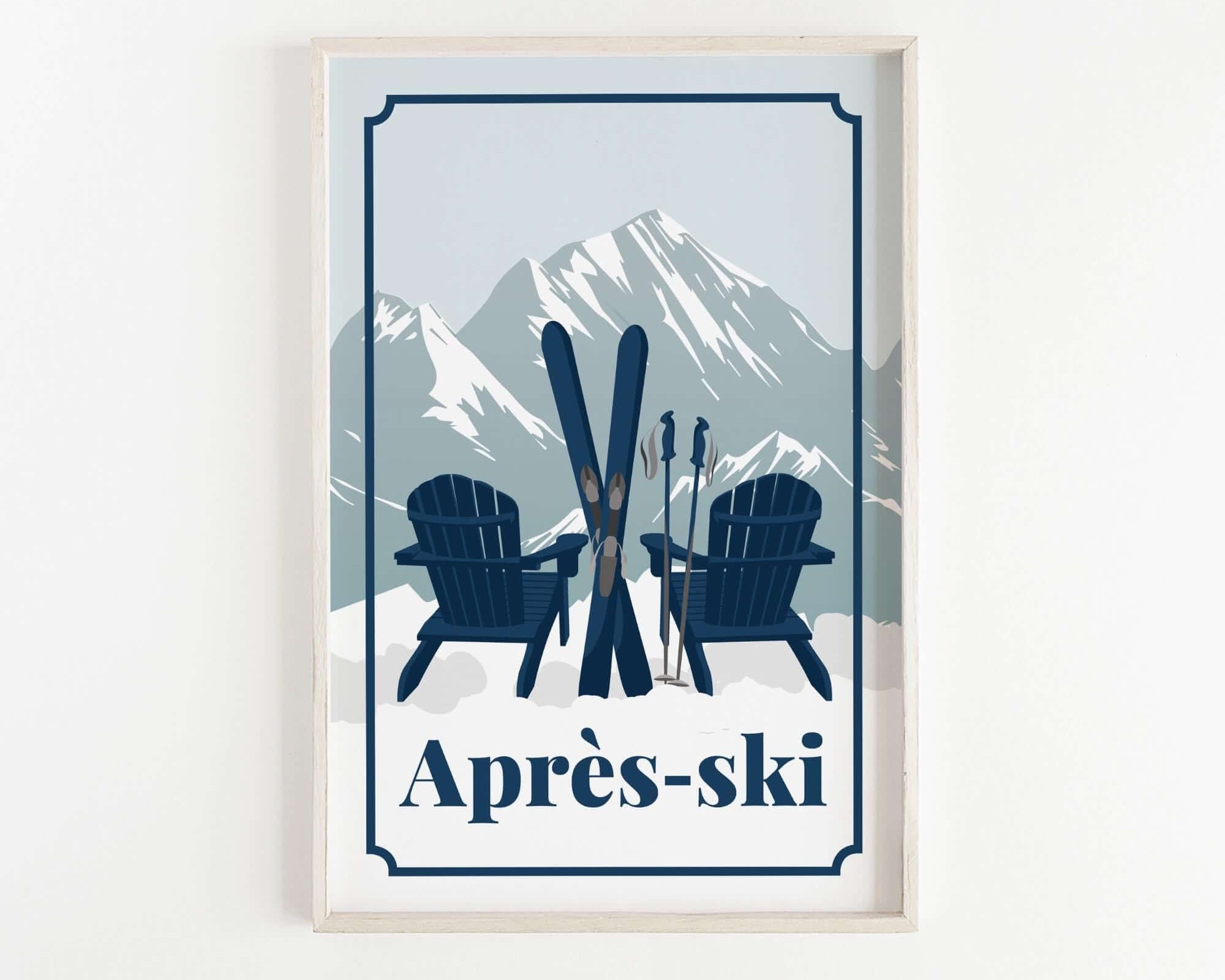 A framed print featuring a pair of blue Adirondack chairs with skis and poles, set against a snowy mountain backdrop.