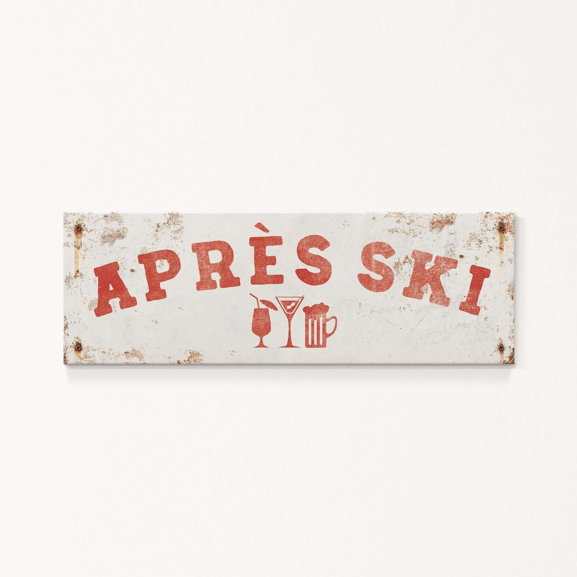 A weathered sign with the text "APRES SKI" in red letters, along with icons of a beer mug and a martini glass, indicating a location or establishment related to skiing and alcoholic beverages.