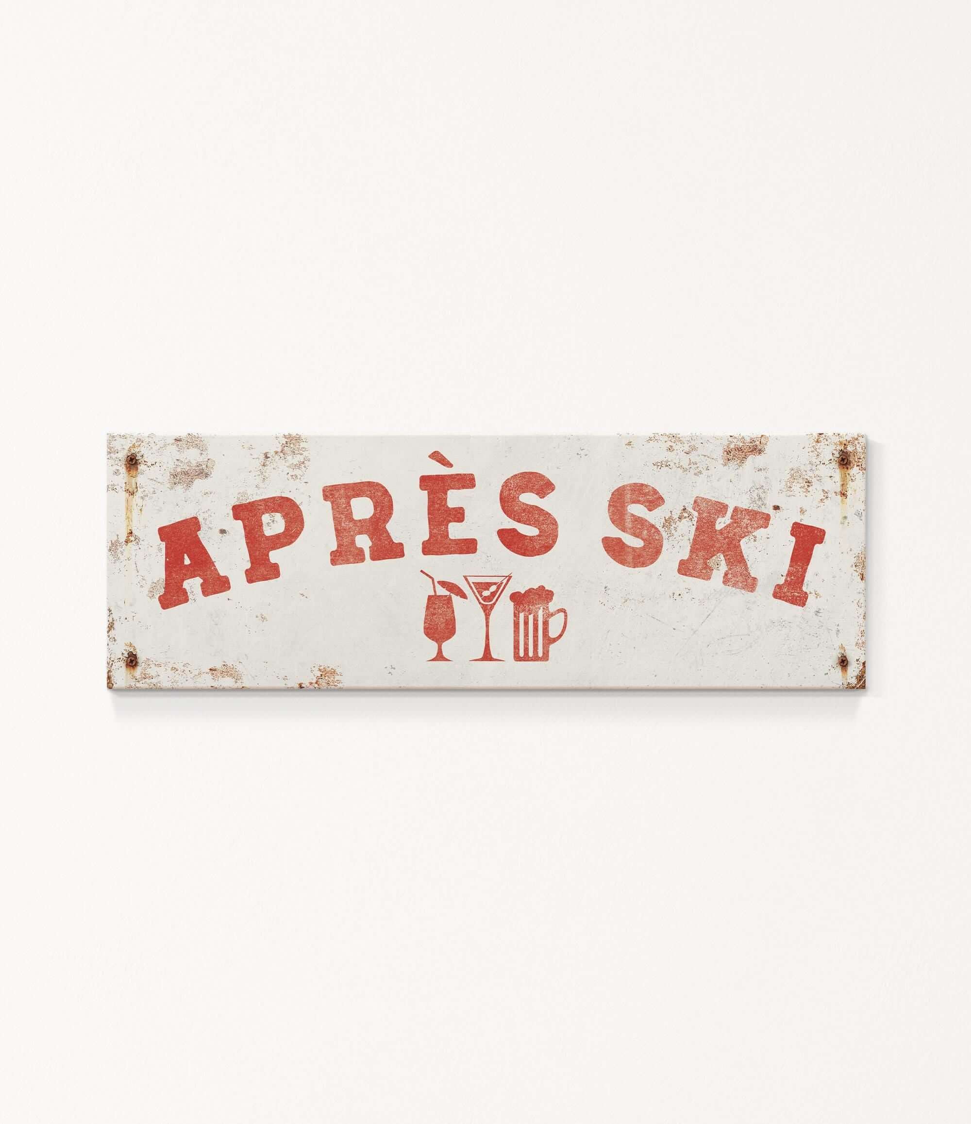 A weathered sign with the text "APRES SKI" in red letters, along with icons of a beer mug and a martini glass, indicating a location or establishment related to skiing and alcoholic beverages.