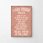 a sign on a wall that says lake house rules