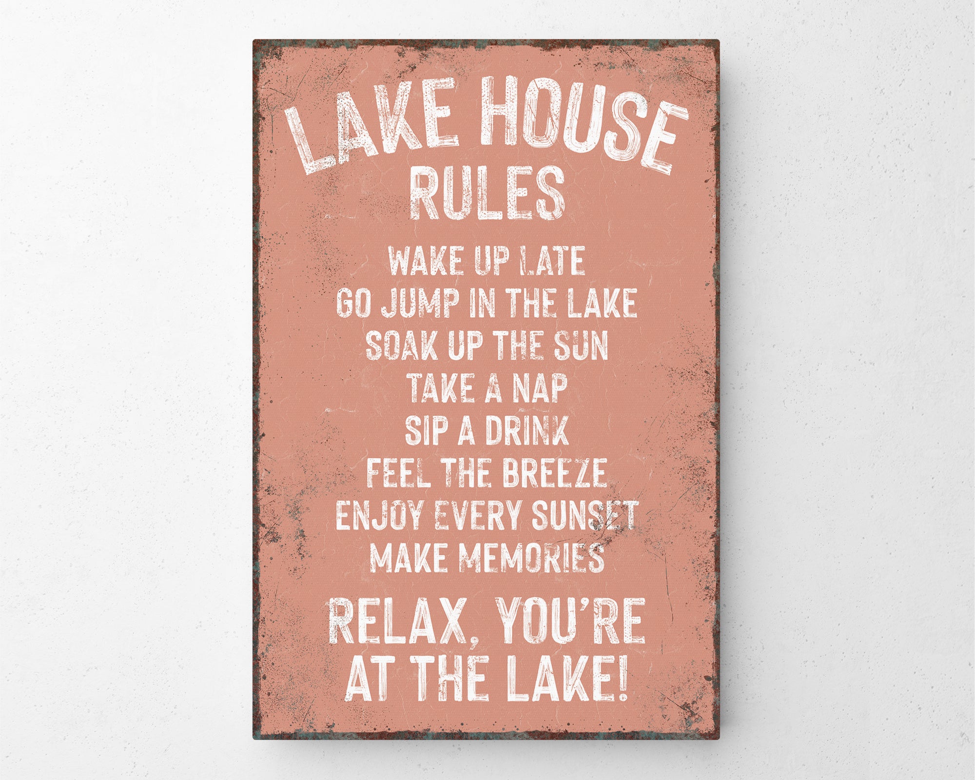 a sign on a wall that says lake house rules