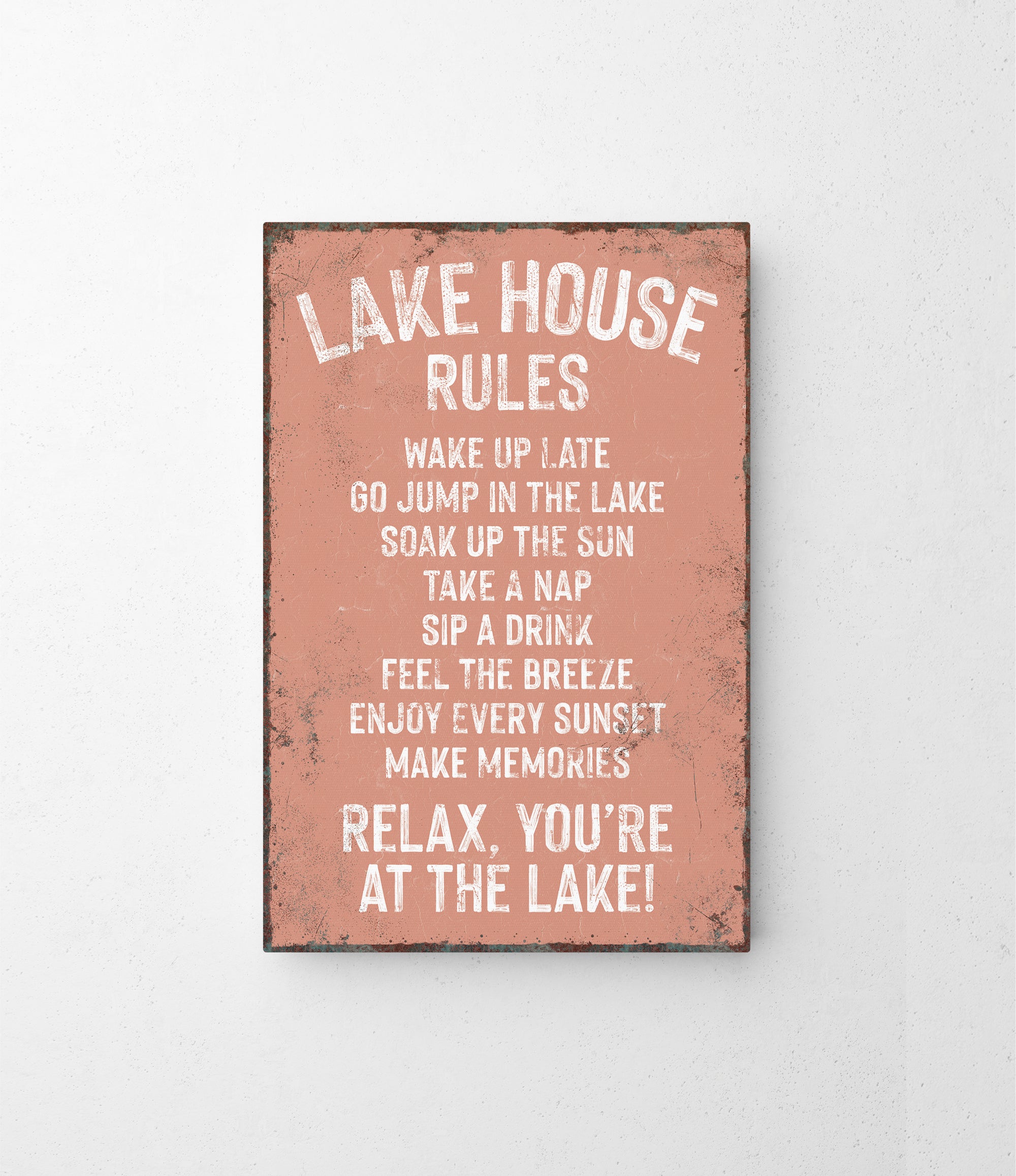 a sign on a wall that says lake house rules