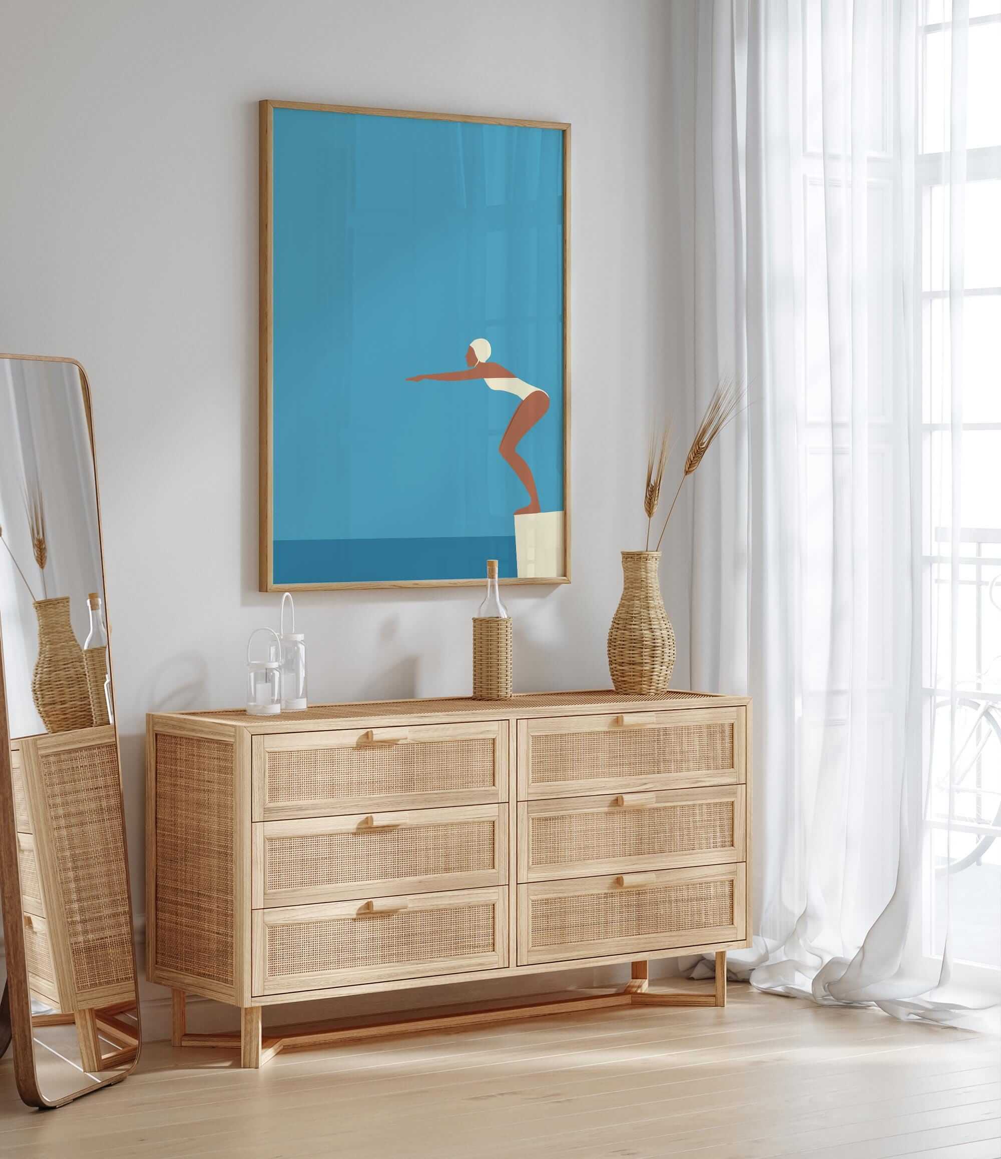 a modern, minimalist bedroom with a large mirror, a wooden dresser, and a framed artwork depicting a woman in a swimming pose.