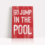 a red sign that says go jump in the pool