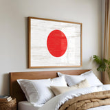 a bed with white sheets and a red circle on the wall