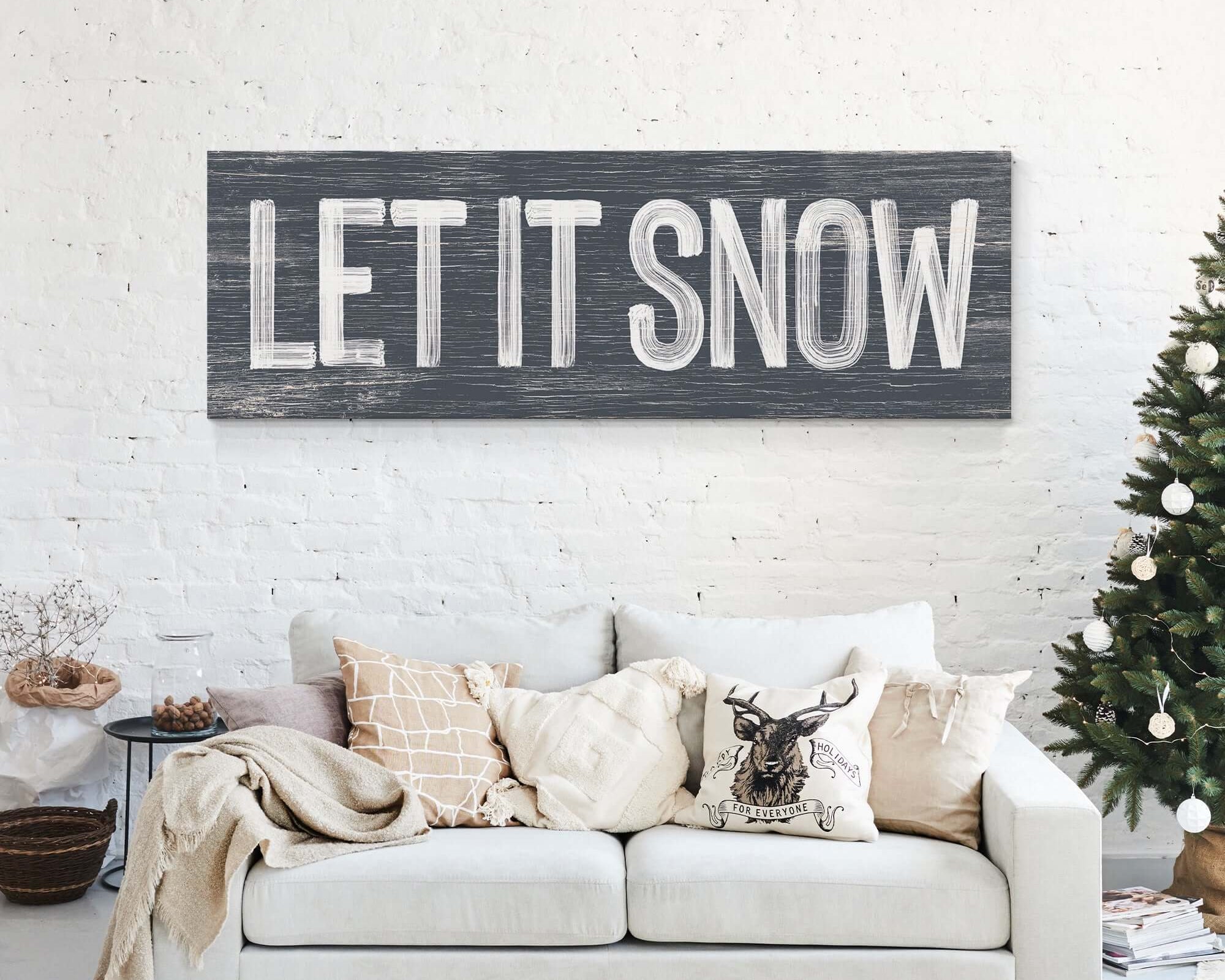 a living room with a couch and a christmas tree