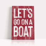 a wooden sign that says let&#39;s go on a boat