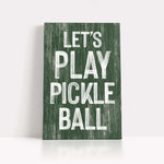 a wooden sign that says let's play pickle ball