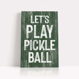 a wooden sign that says let's play pickle ball