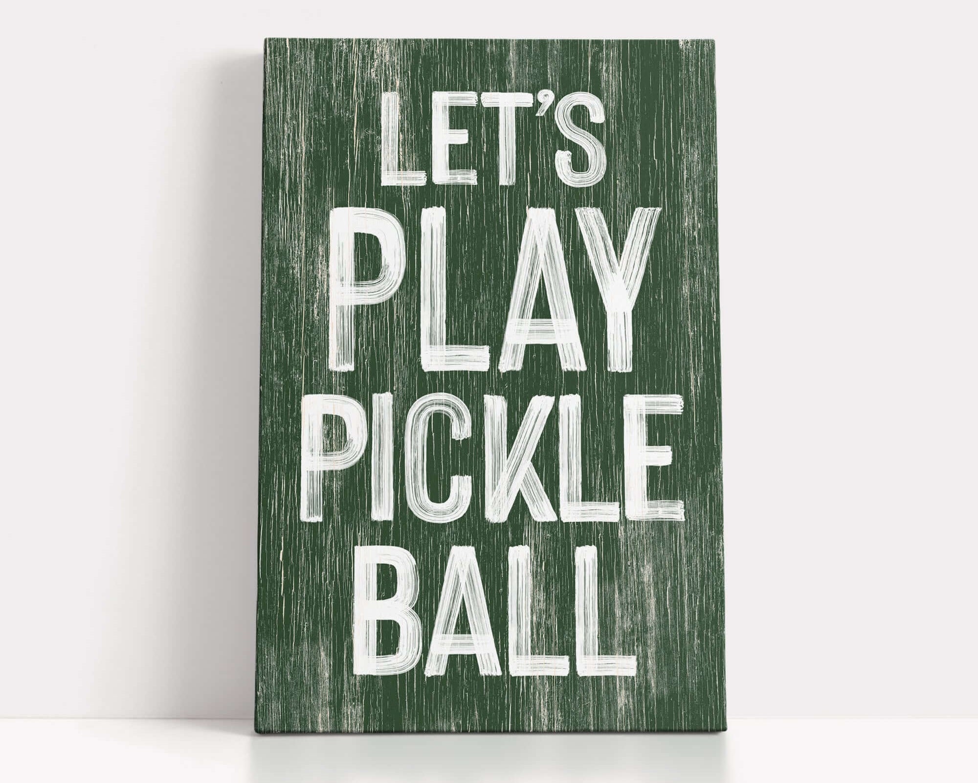 a wooden sign that says let's play pickle ball