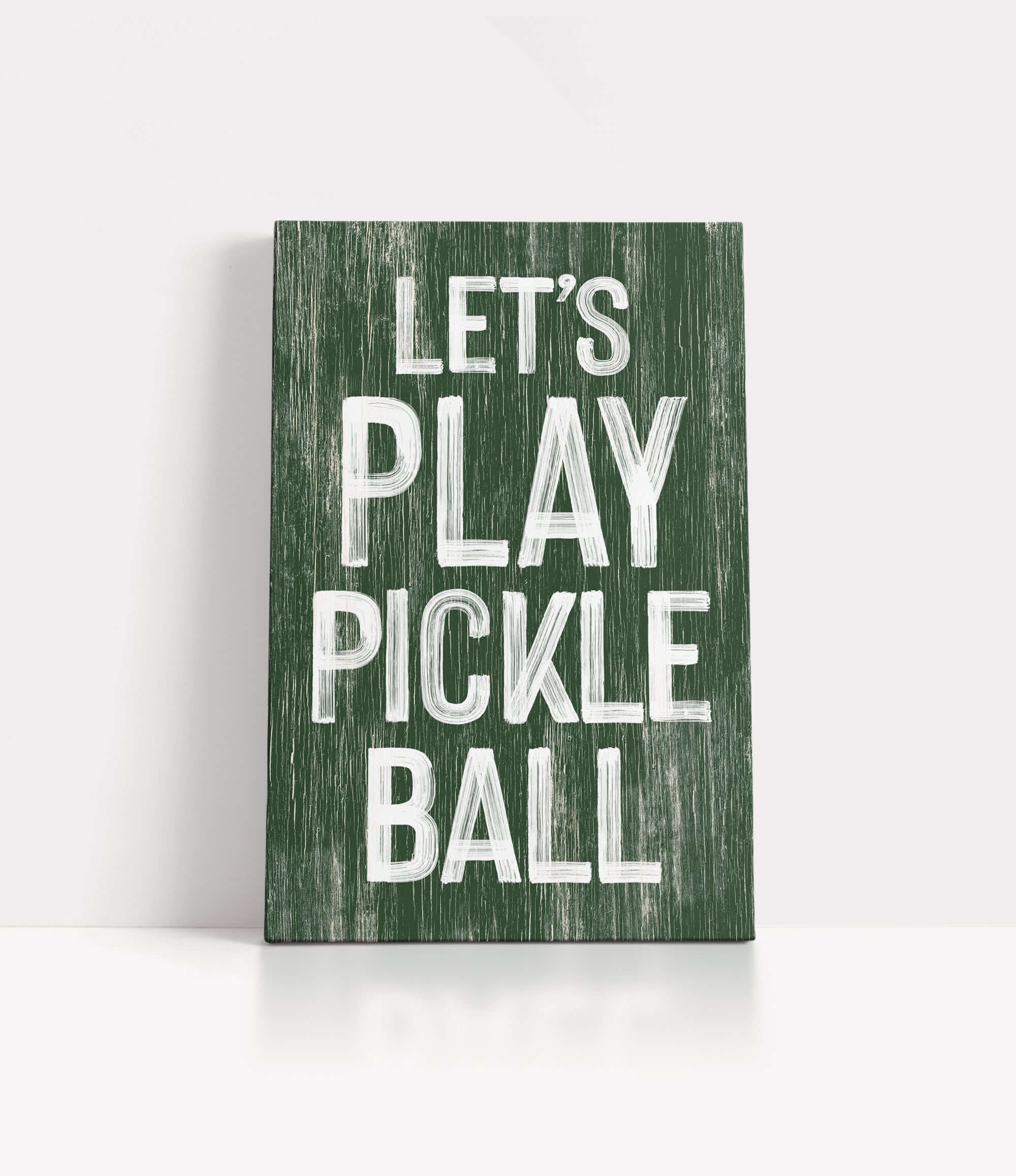 a wooden sign that says let's play pickle ball