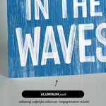 a blue sign that says in the waves