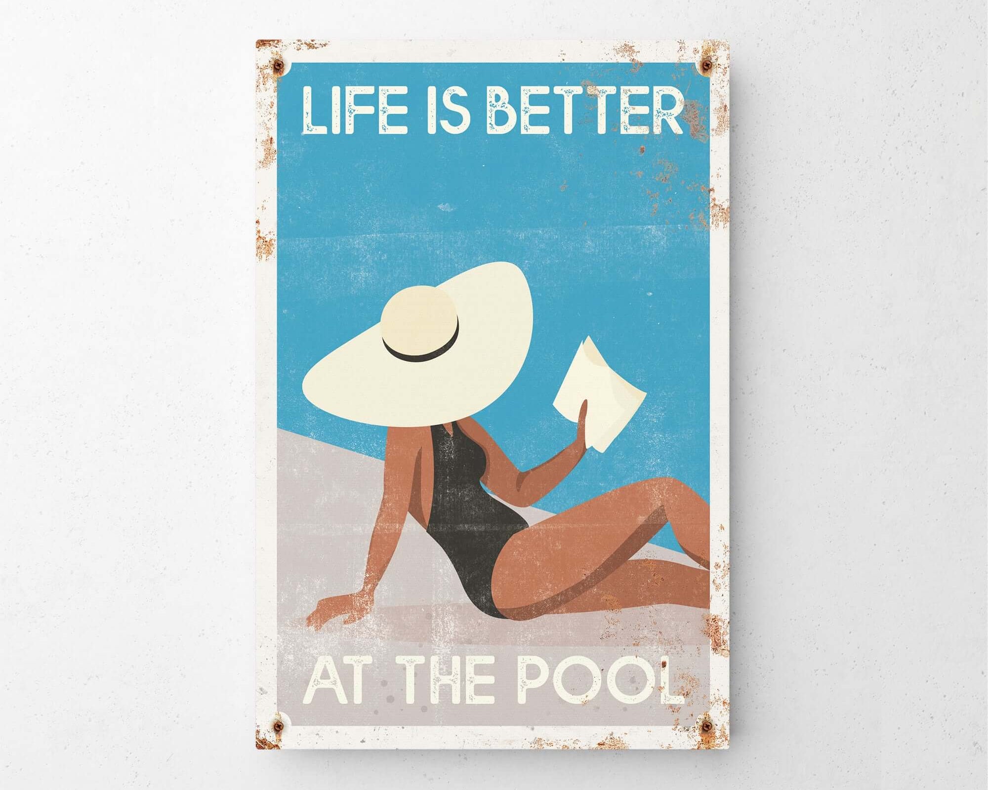 a picture of a woman in a bathing suit reading a book