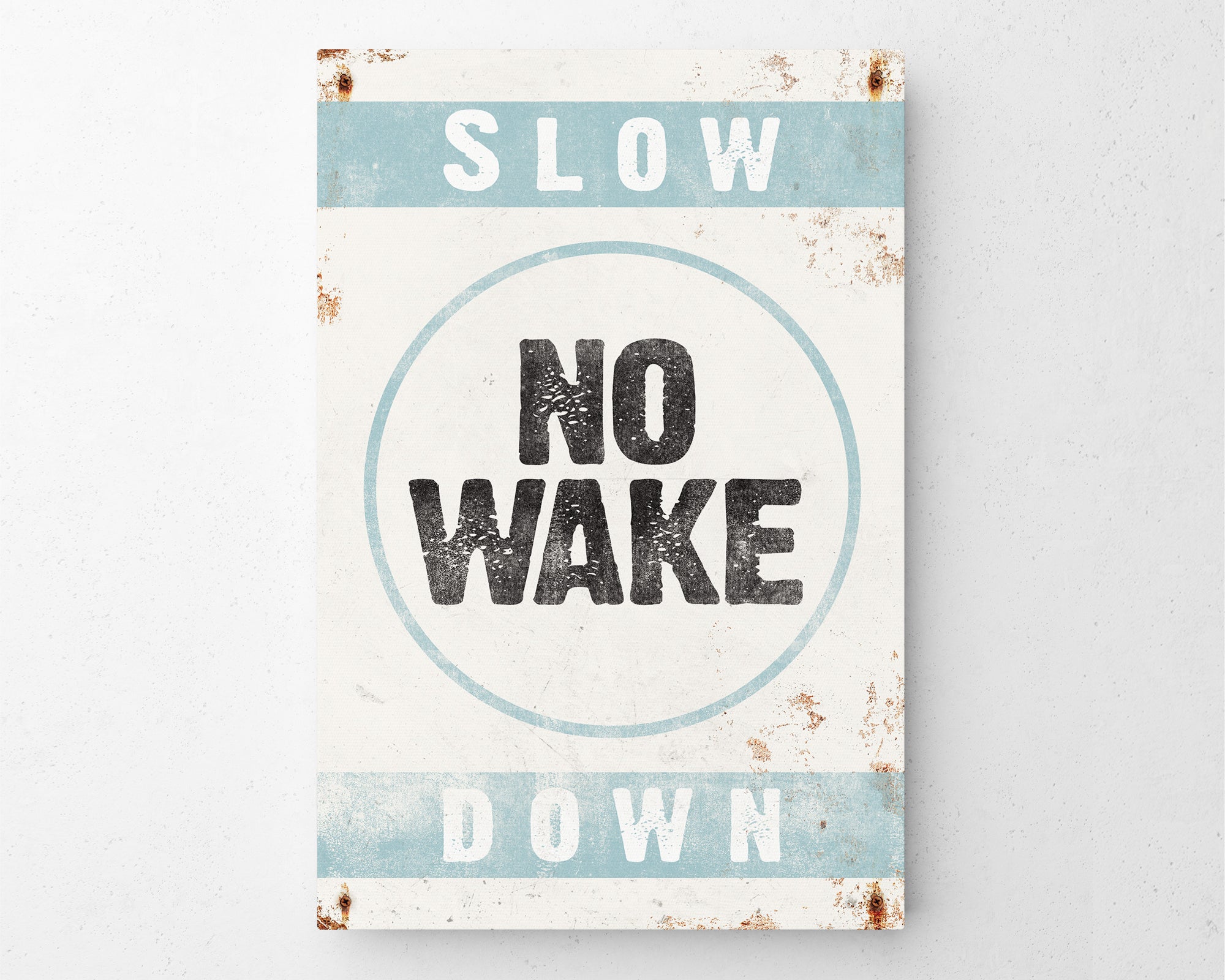 a sign that says slow no wake down