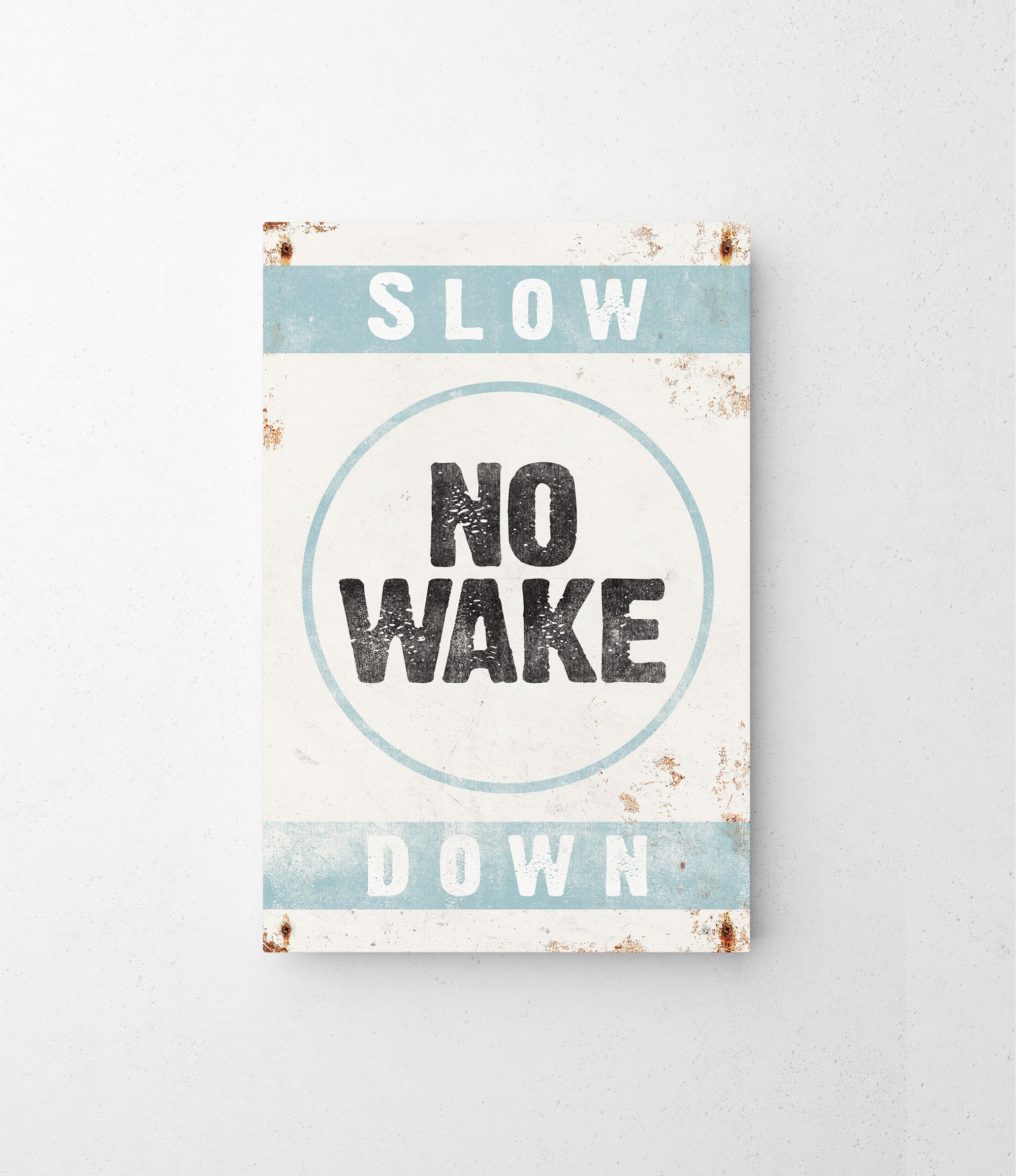 a sign that says slow no wake down