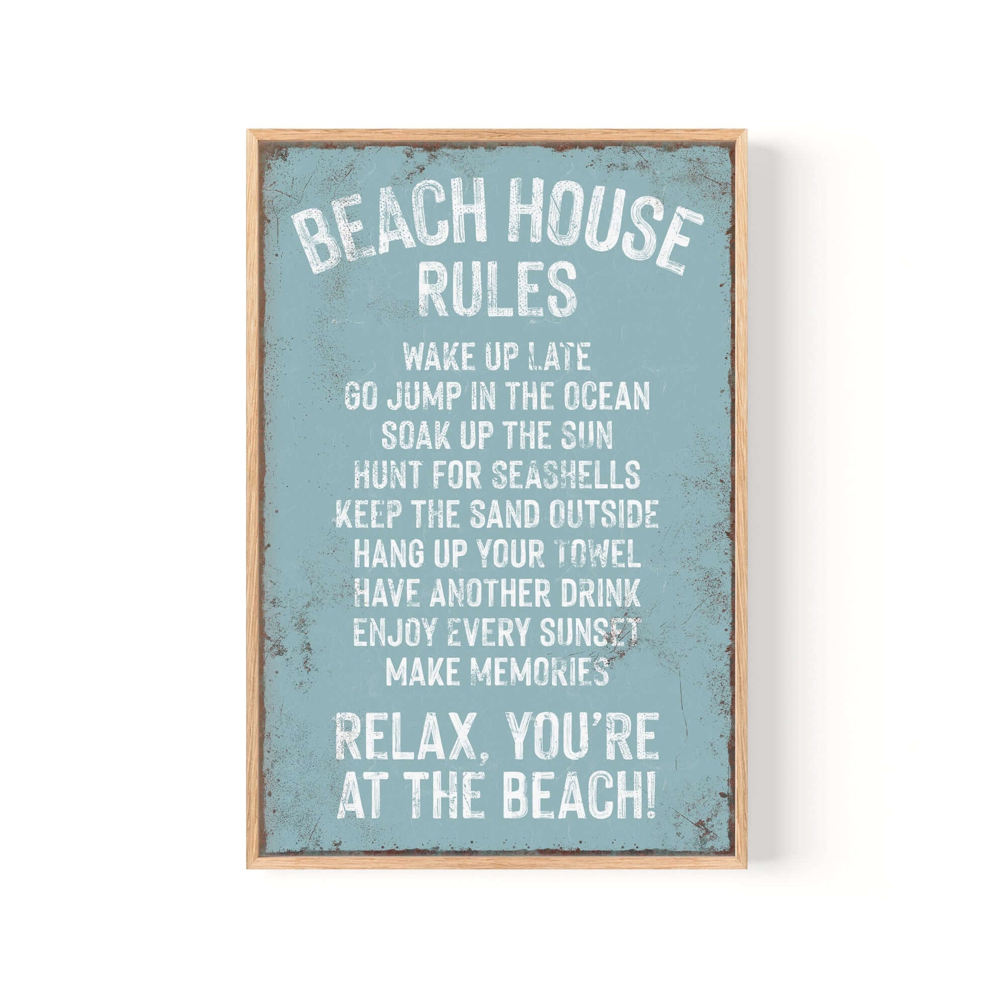 The Beach House Rules Sign, Tide edition, features rusted edges and beach-themed rules on a blue distressed background—a perfect coastal wall decor accent.