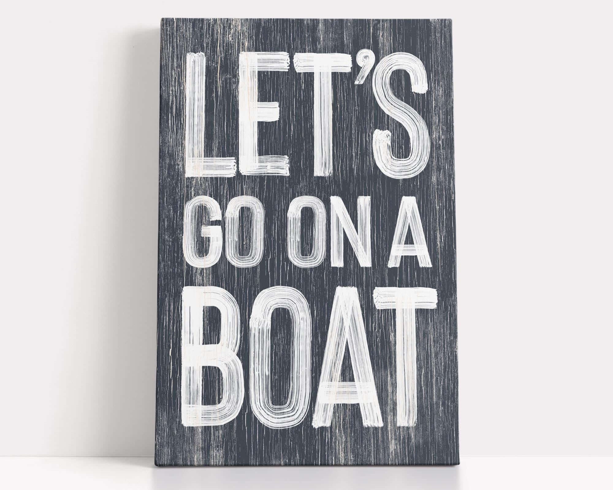 a wooden sign that says let's go on a boat