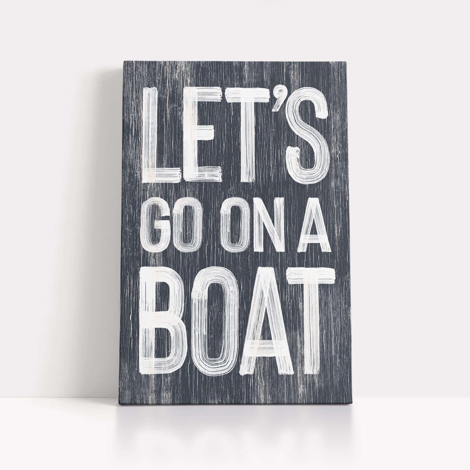 a wooden sign that says let's go on a boat