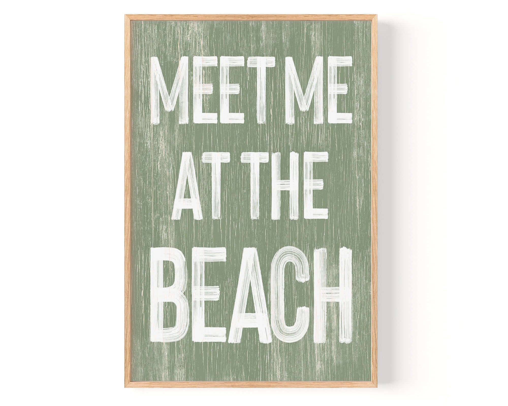 a green and white sign that says meet me at the beach