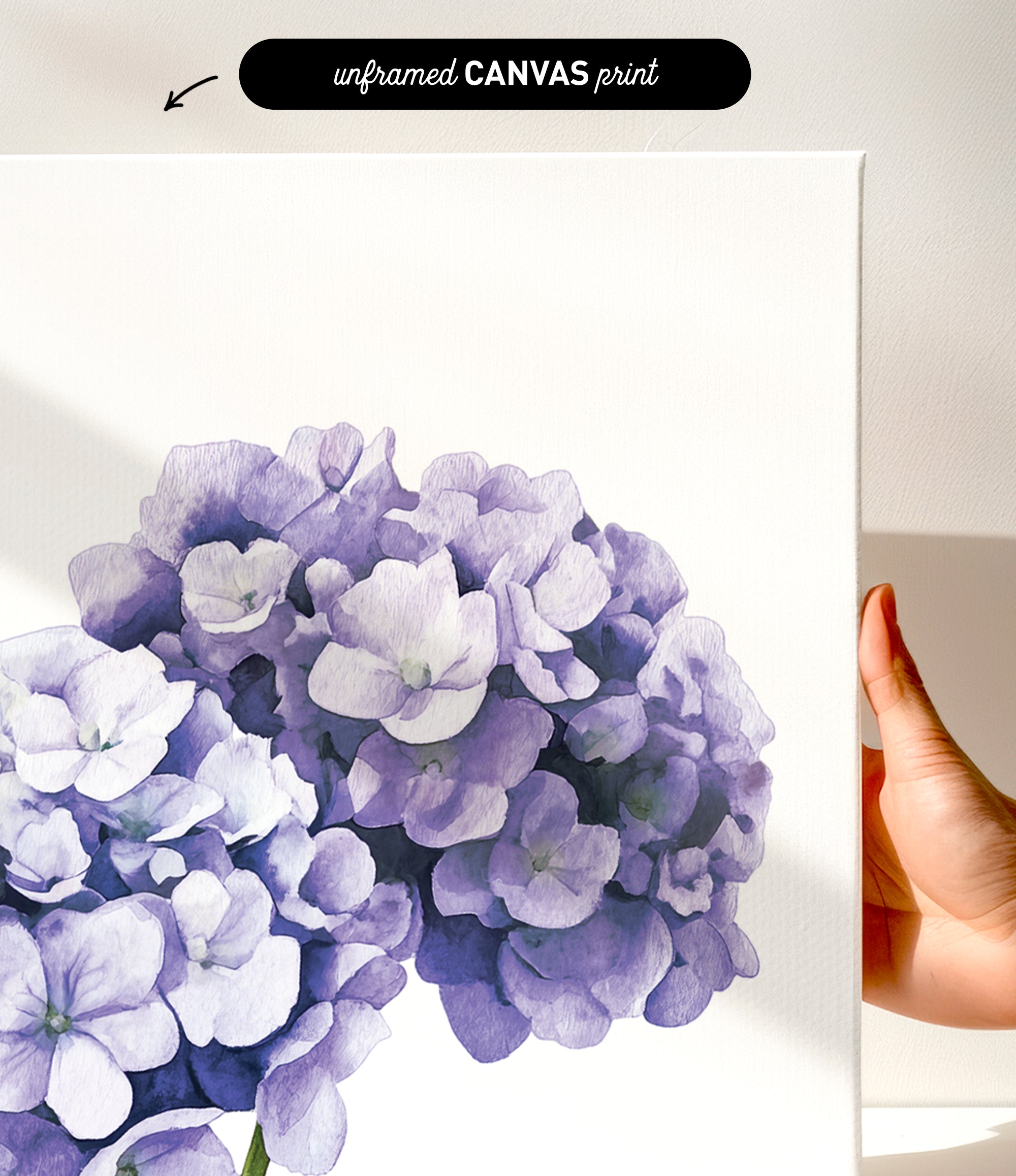 a close-up of a white canvas print with a vibrant purple flower design.